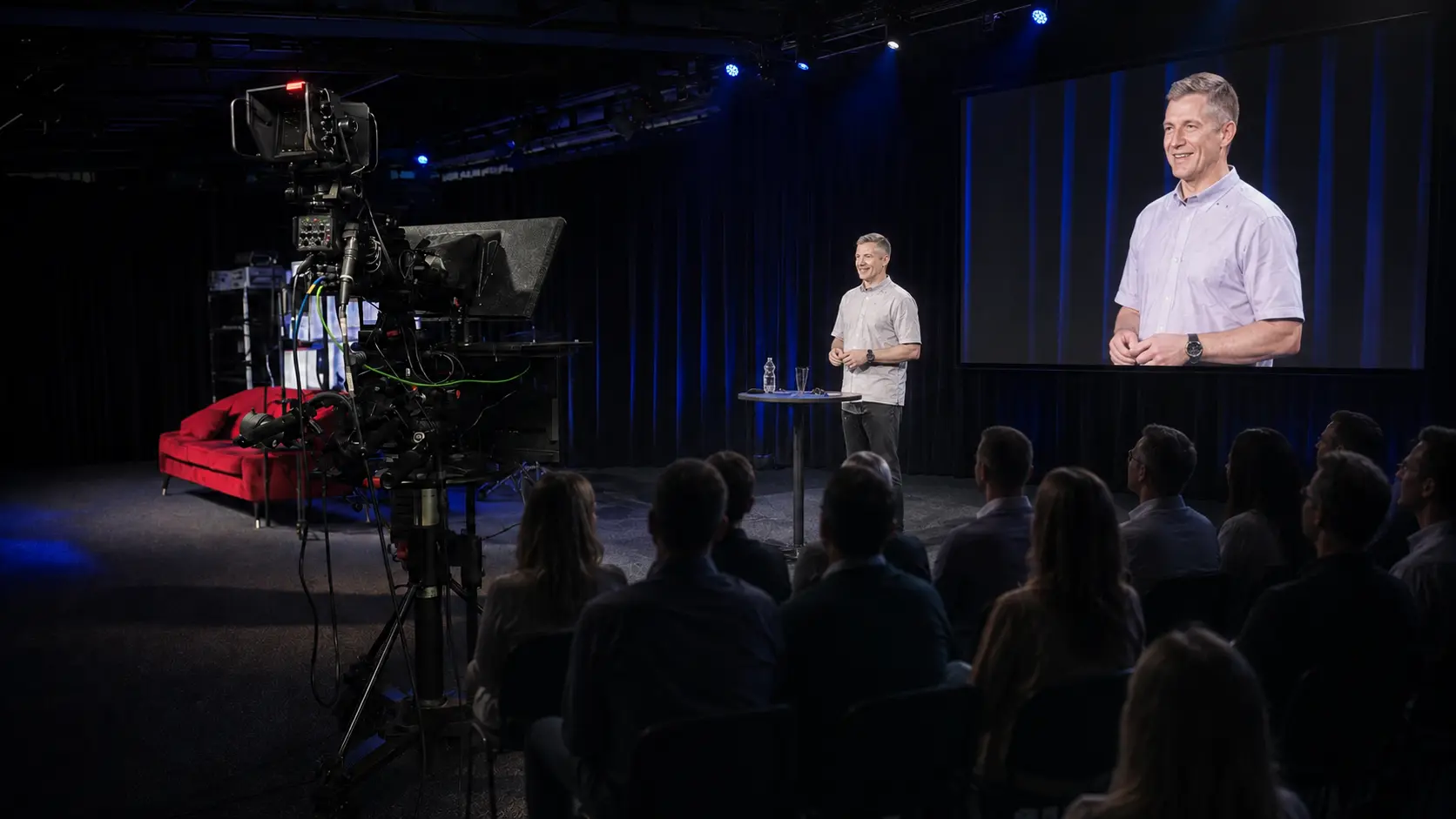 Hybrid Studio4x illustration of an event live production with a stage, realistic cameras, vision control, in-room video, streaming and recording